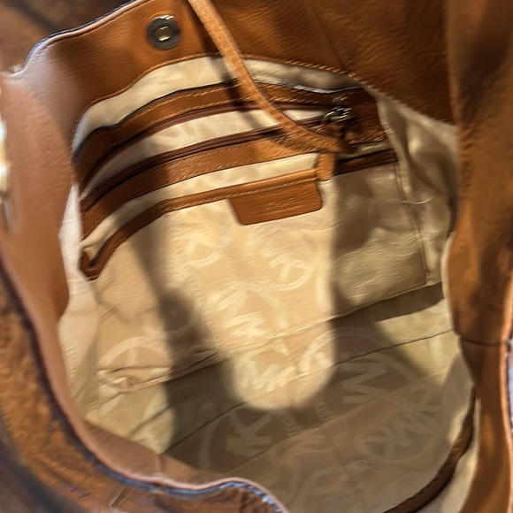 Michael Kors tan leather purse. Gold emblem. Gently used
Snap closure dust bag - Picture 5 of 9